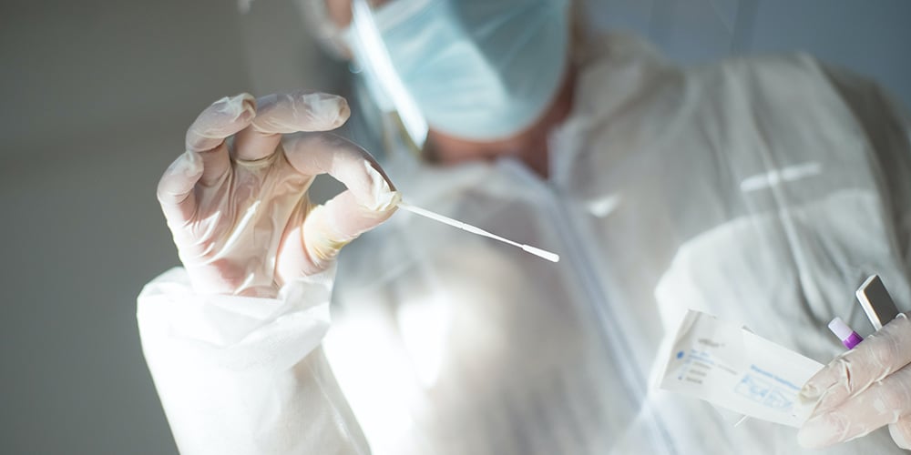 doctor getting some saliva to test for ecstasy