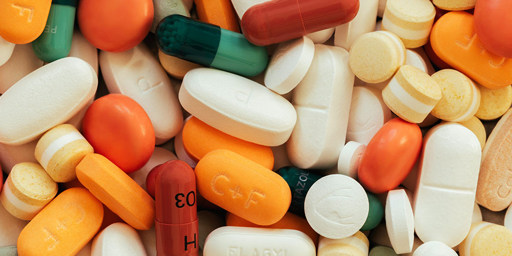a large quantity of different kinds of medicine piled together