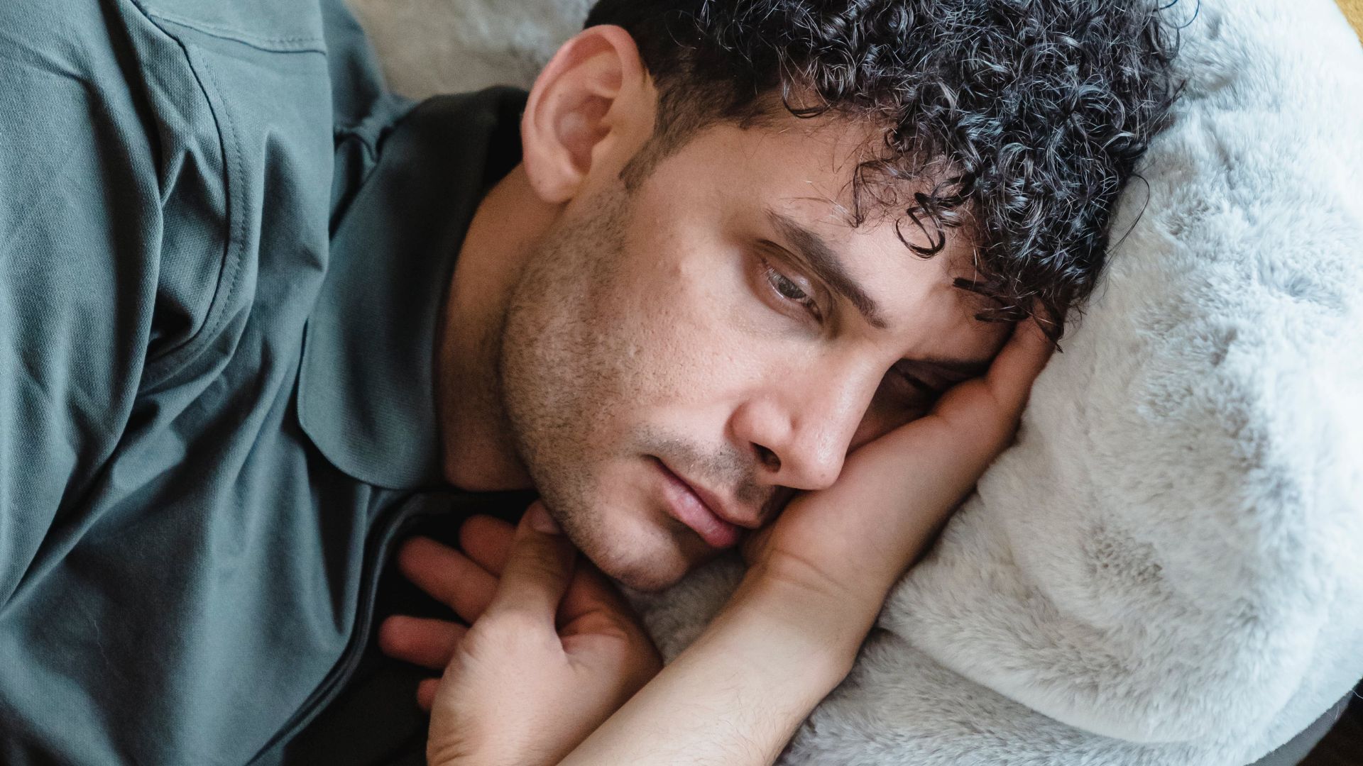 photo of a man having trouble sleeping