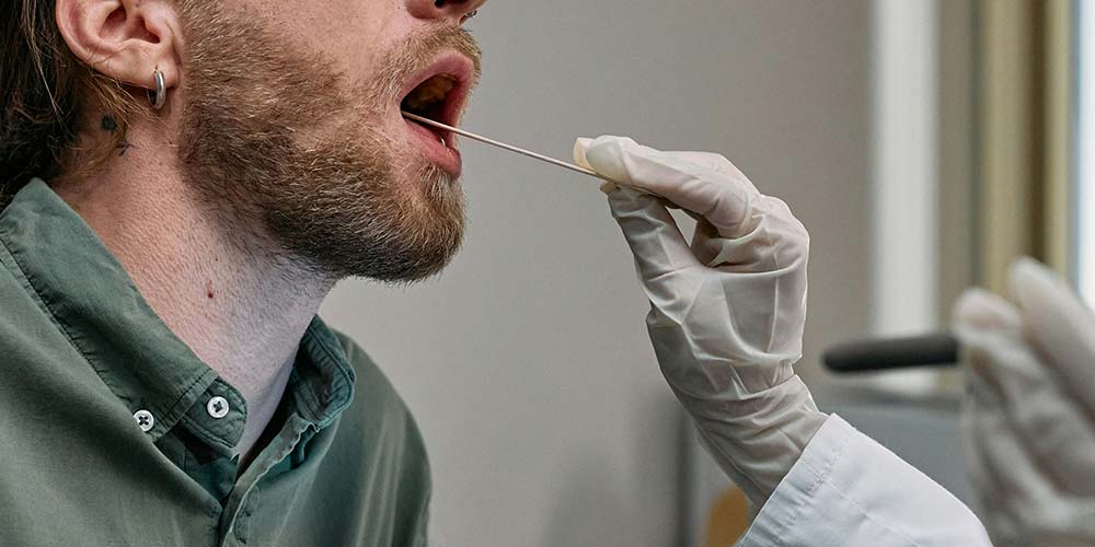 man getting a saliva test