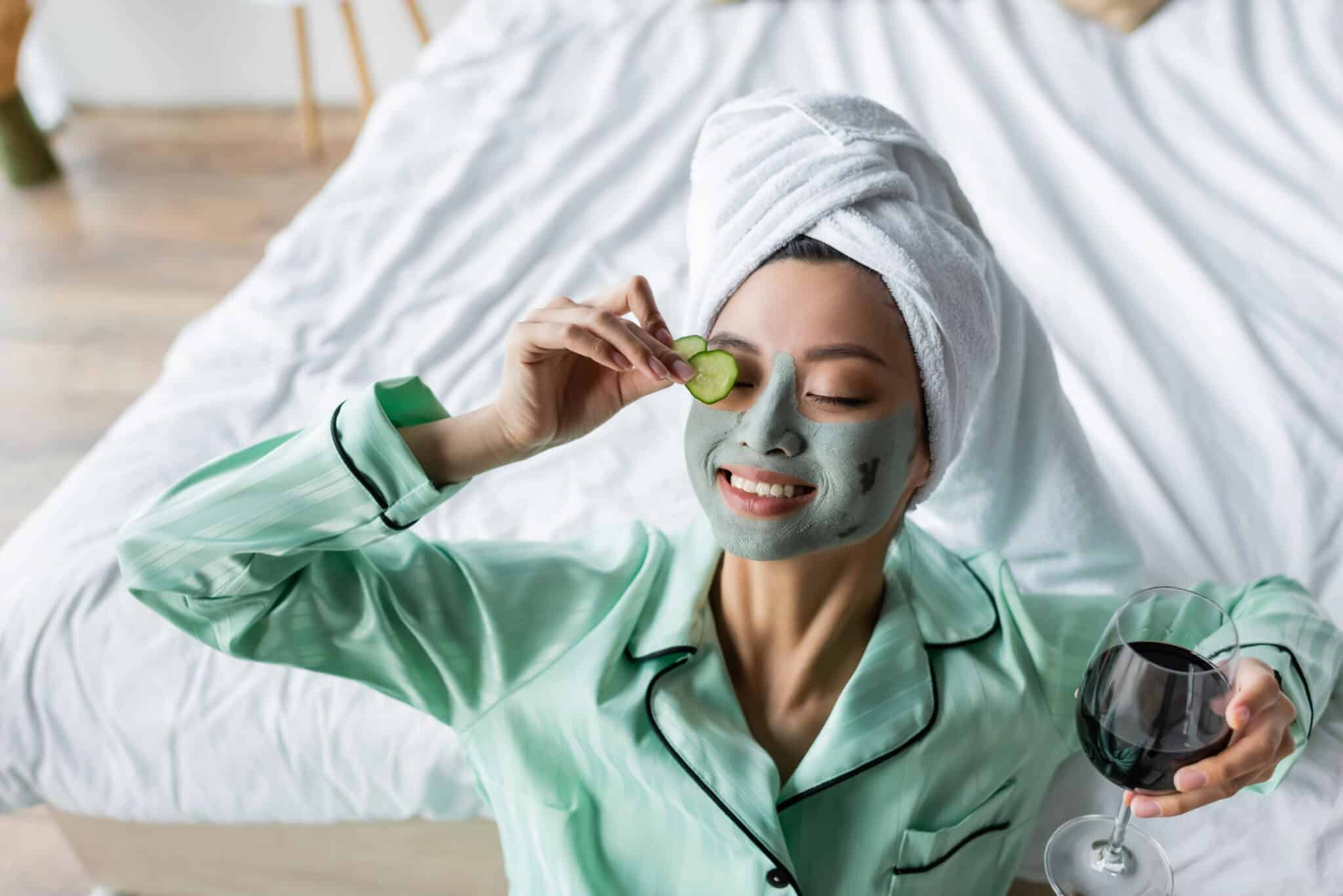 joyful asian woman clay mask