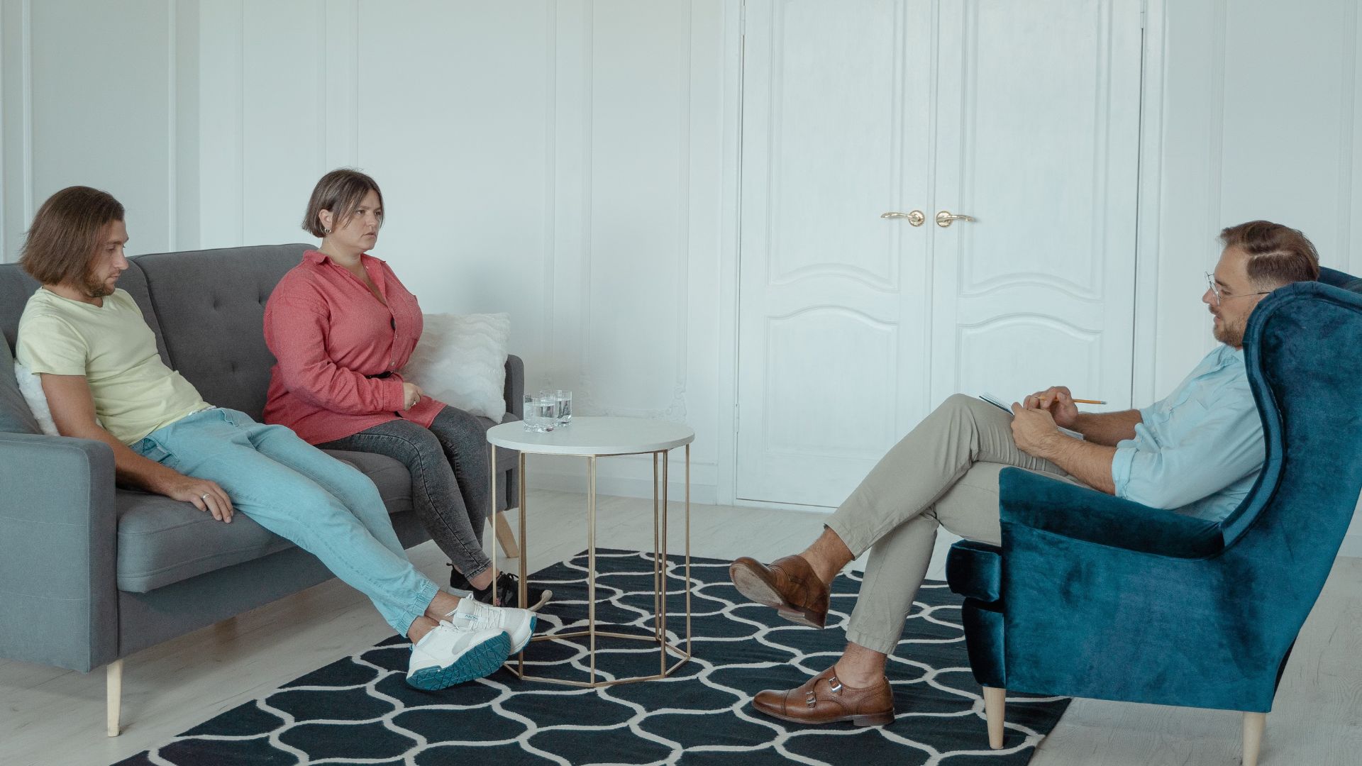 A married couple consulting with a therapist