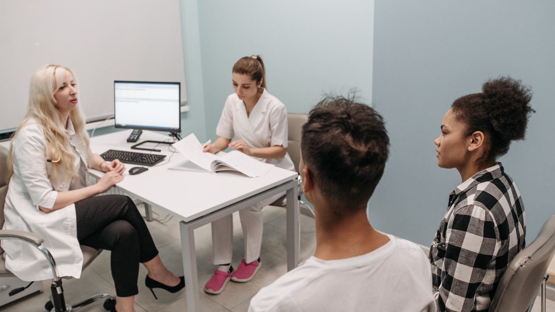 Doctor and patients during a consultation in a modern clinic