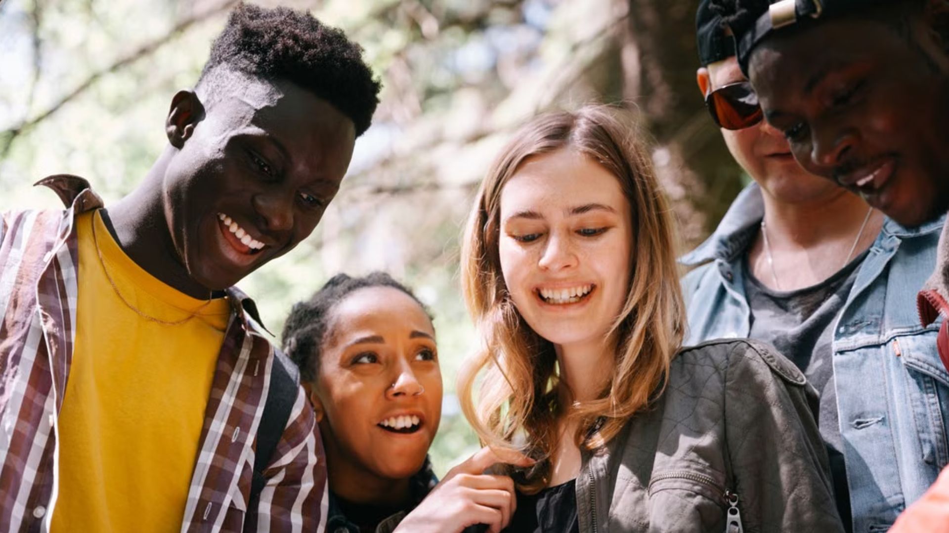 diverse young adults enjoying a moment together outdoors